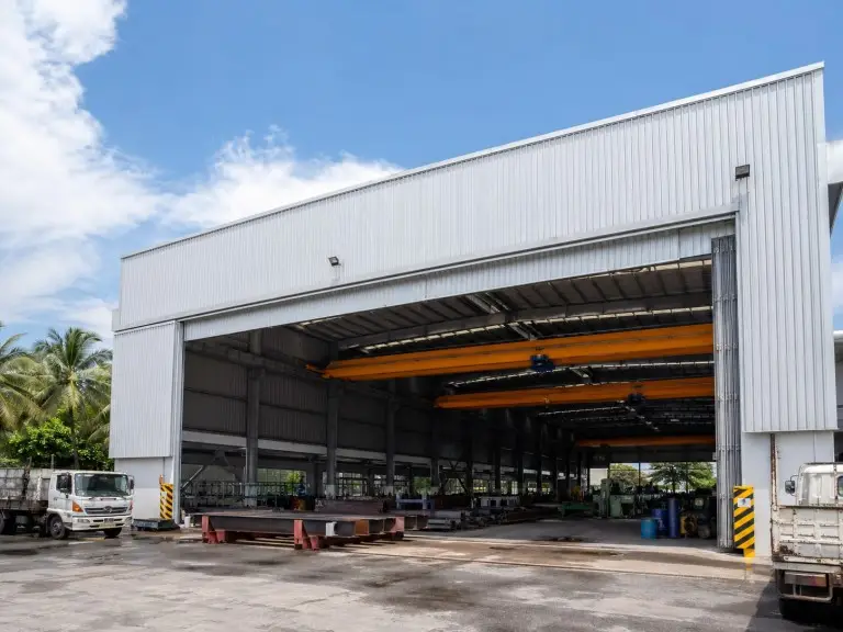 Steel workshop building — automotive parts fabrication and assembly workshop with dual crane runway, Southeast Asia