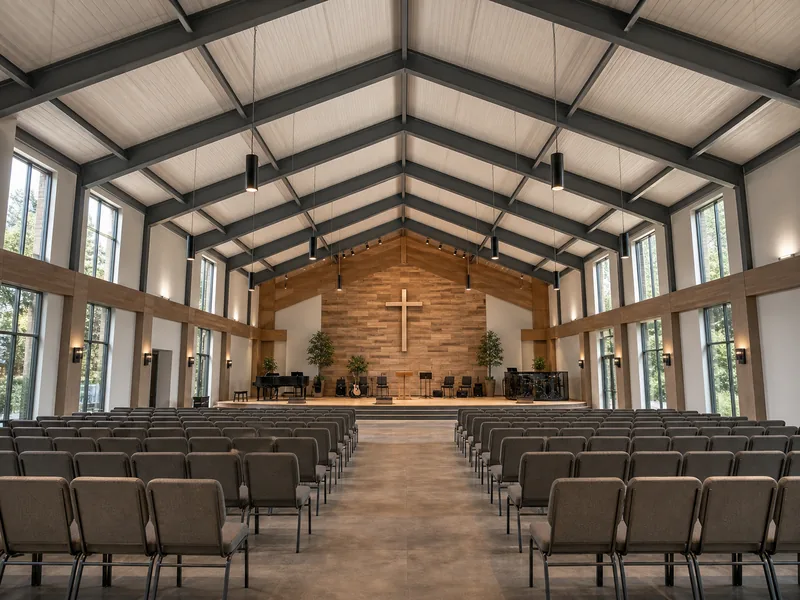 Column-free clear-span sanctuary interior of a church building with open