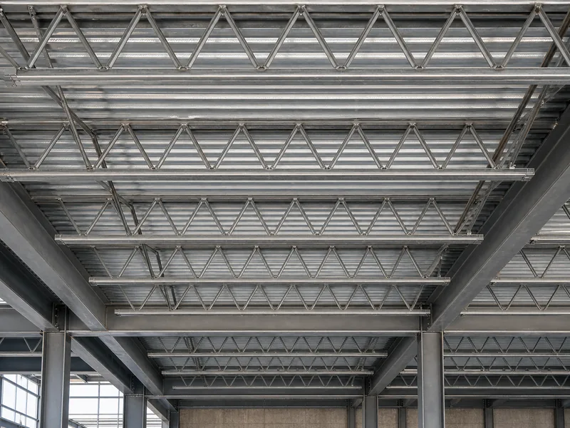 Open-web steel joists spanning flat between supports for a floor